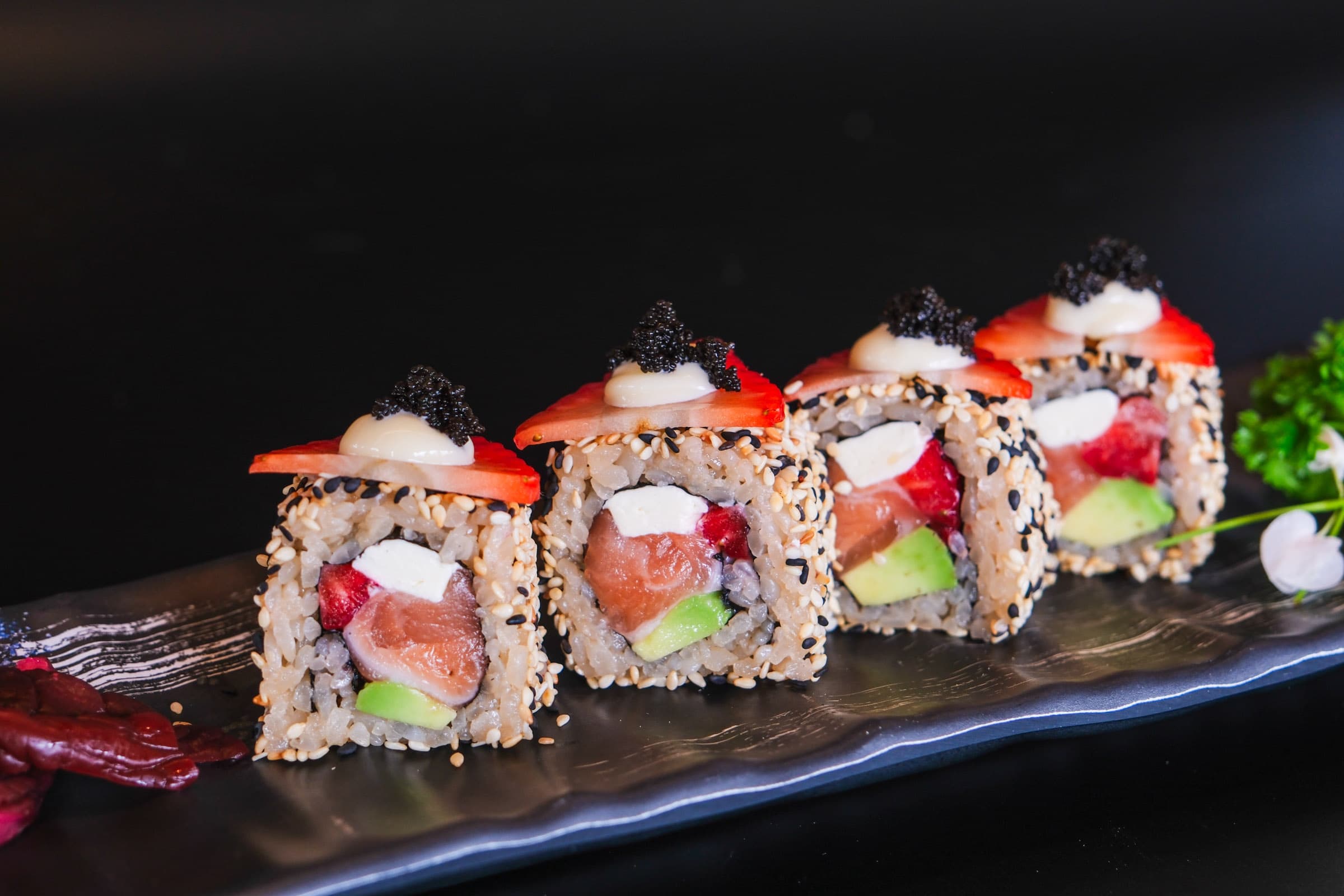 Sesame-crusted rolls with strawberry and caviar