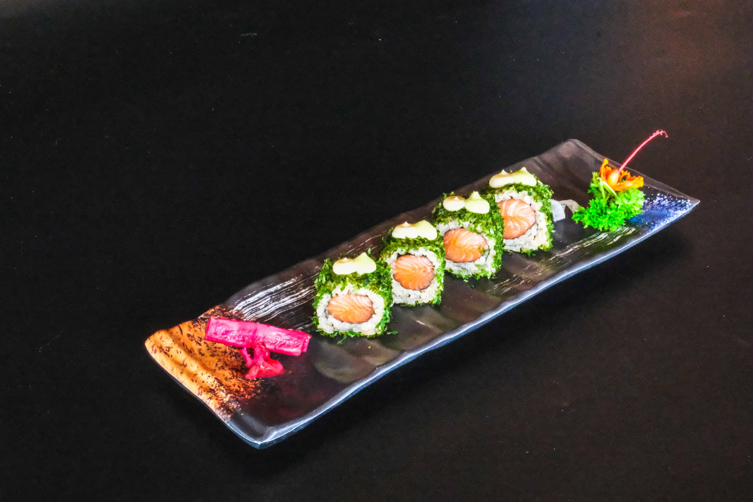 Salmon roll wrapped in fresh seaweed