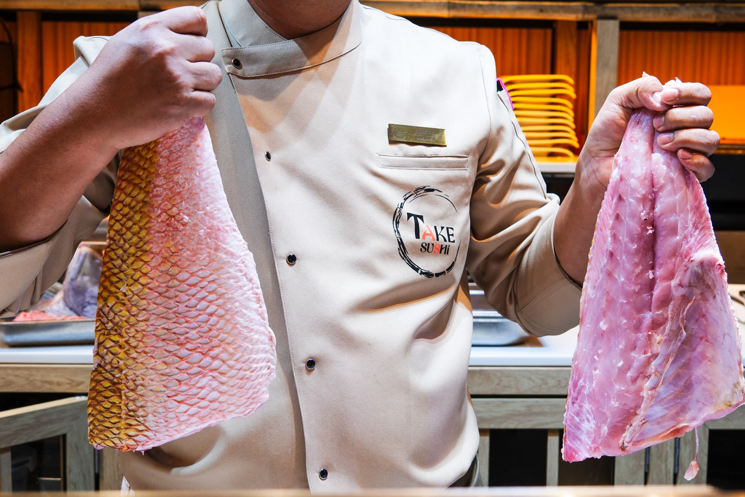 Chef displaying fresh fish fillets